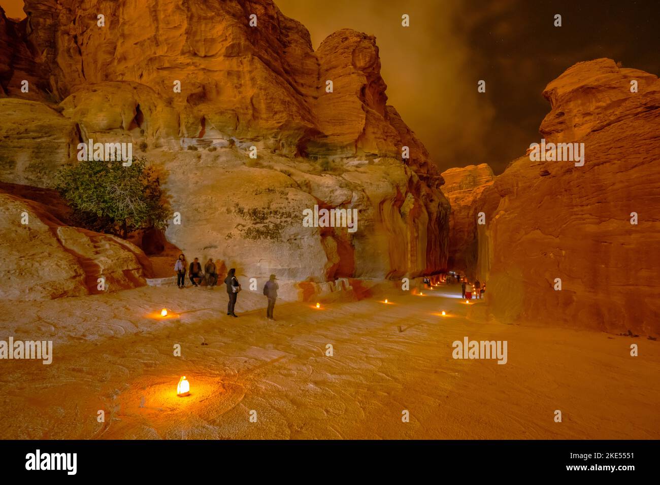 A Siq, the path through the rocks which is the entrance to Petra Jordan at night Stock Photo