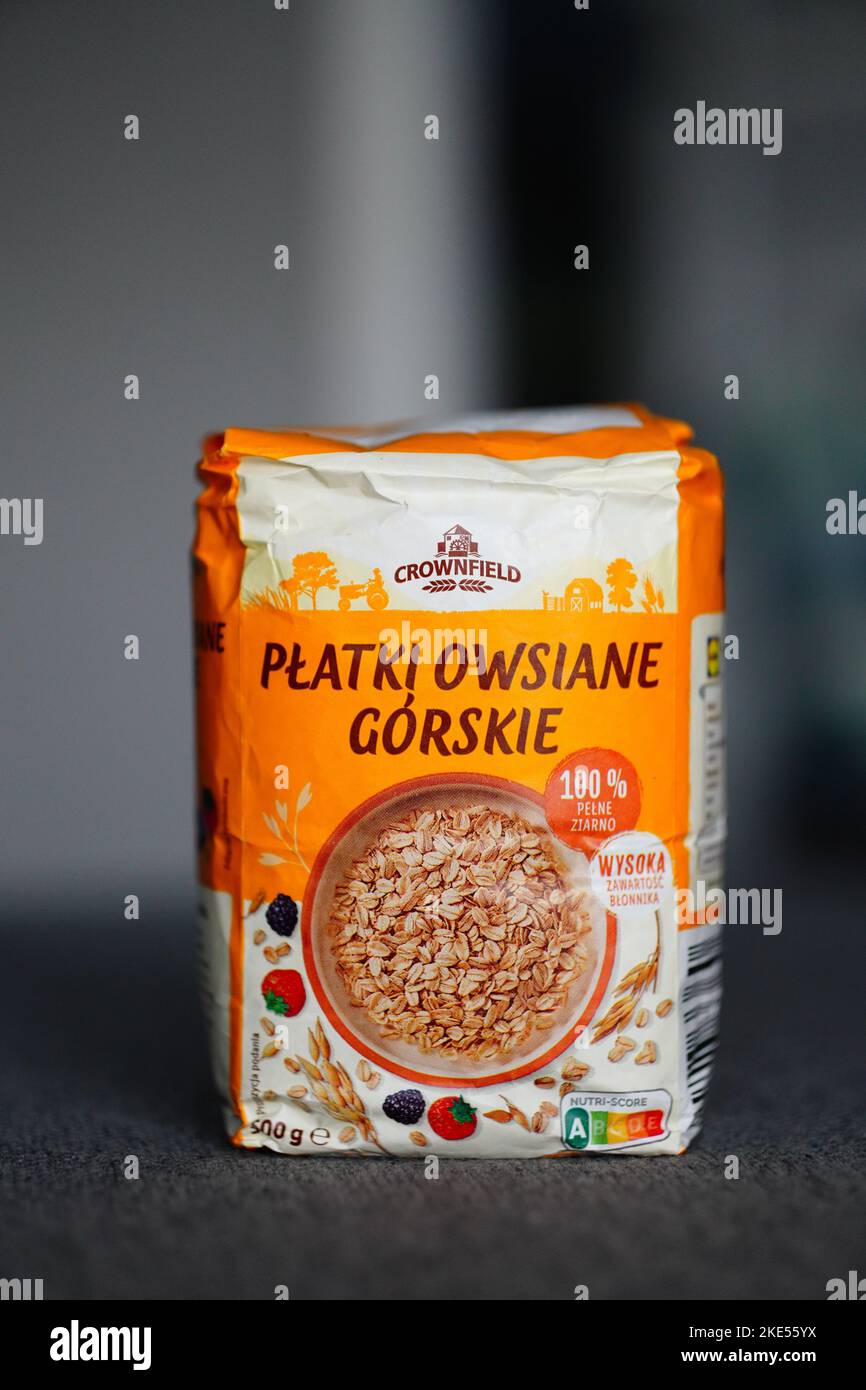 Polish Crownfield brand oat flakes in a paper bag. Stock Photo