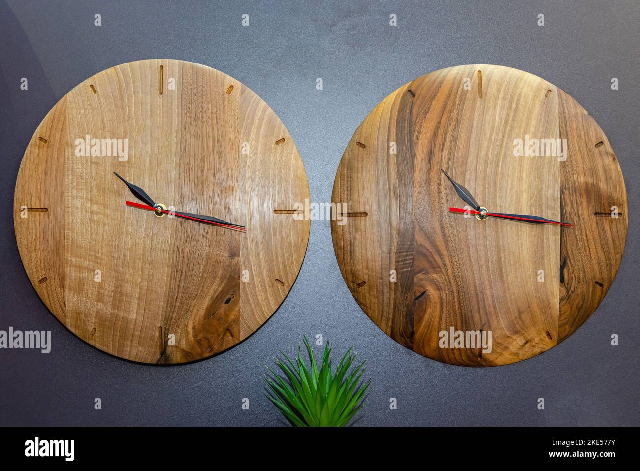 Two Round Clocks Made From Real Wood at Black Wall Stock Photo Alamy