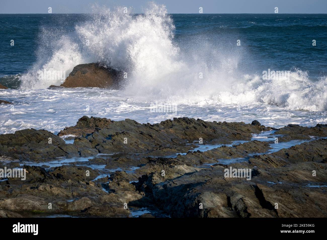 Waves breaking on rocks at Prawle Point, East Prawle, Devon Stock Photo