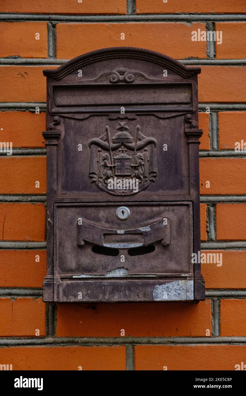 Old vintage mailbox on brick wall Stock Photo