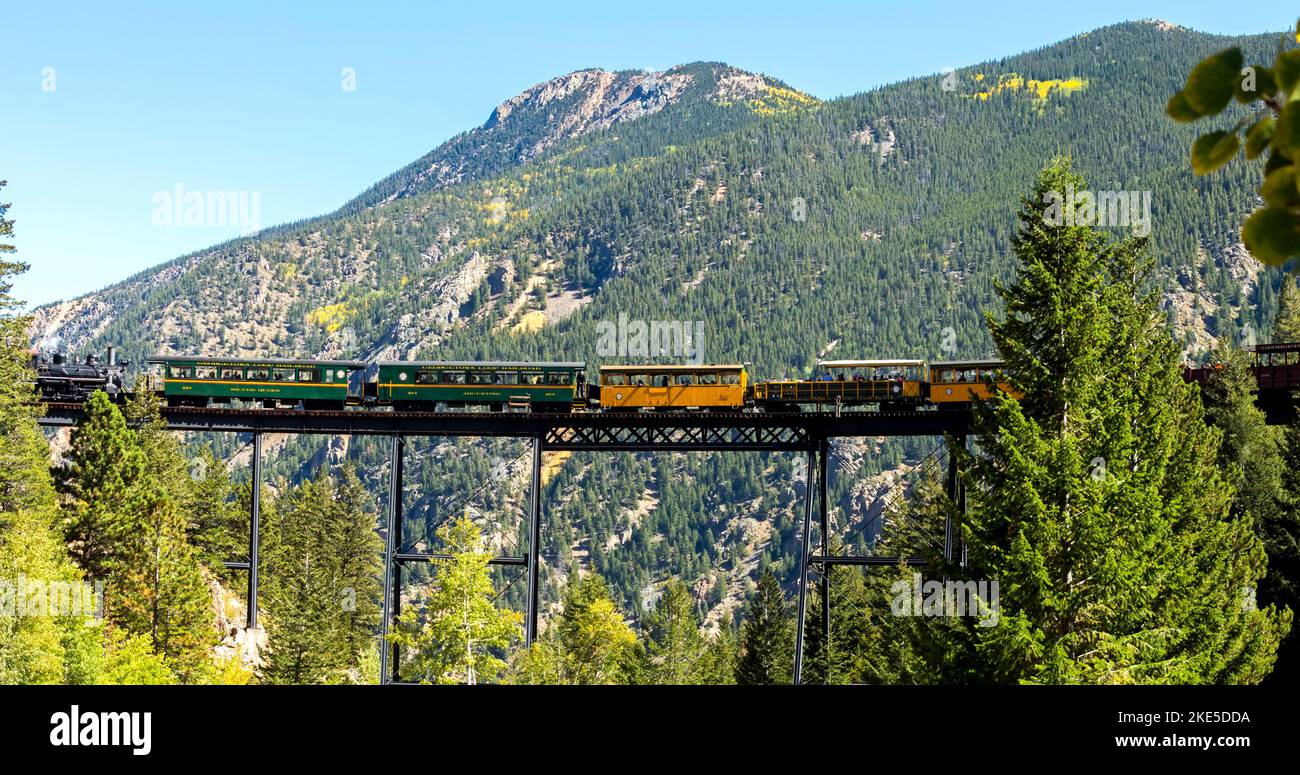 Historic Steam Train with passengers cross the bridge in the Colorado ...