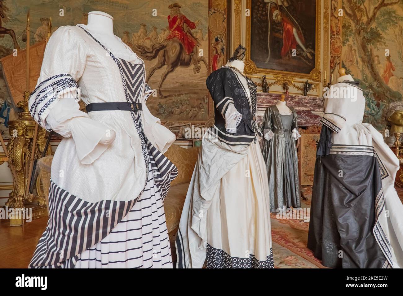 England, Oxfordshire, Woodstock, Blenheim Palace, The Second State Room, costumes from the successful 2018 film The Favourite in which Olivia Colman won an Oscar for her portrayal of Queen Anne. Stock Photo