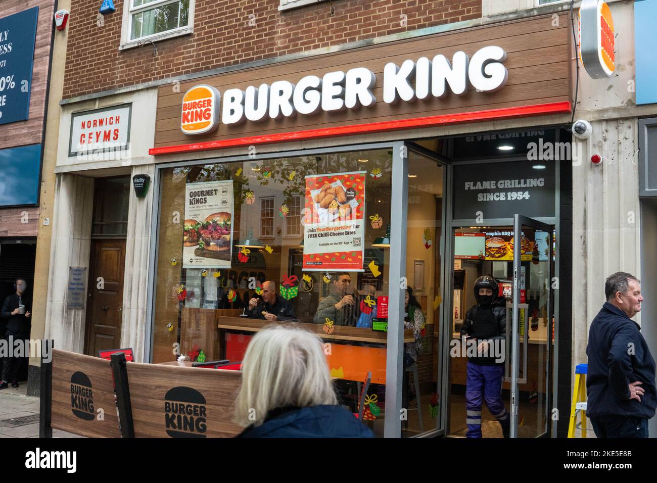 New Burger King restaurant in Brigg Street Norwich city centre with customers going in and out