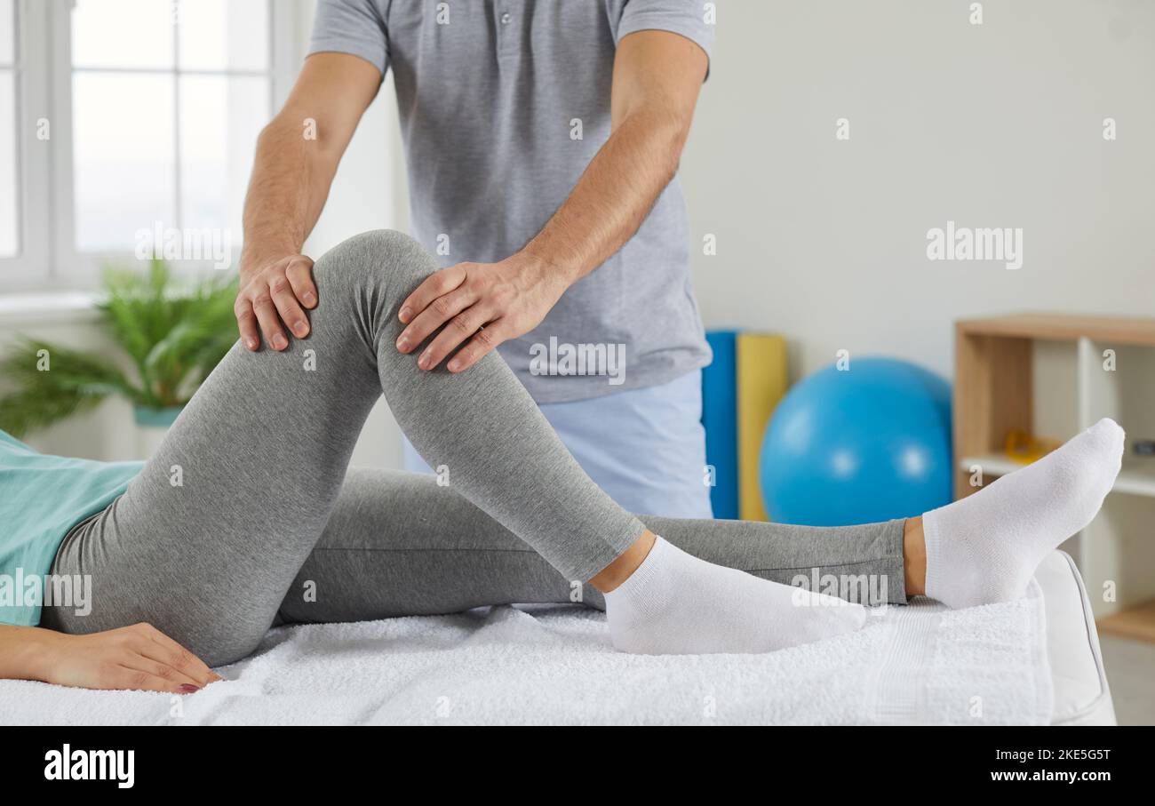 Female patient and male physiotherapist during rehabilitation treatment