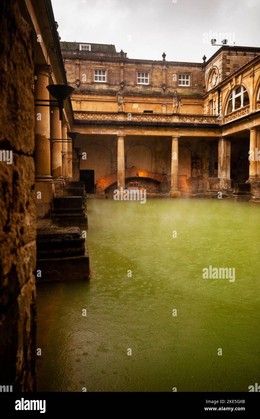 Doric and Ionic columns, oculus window and a terrace with statues are