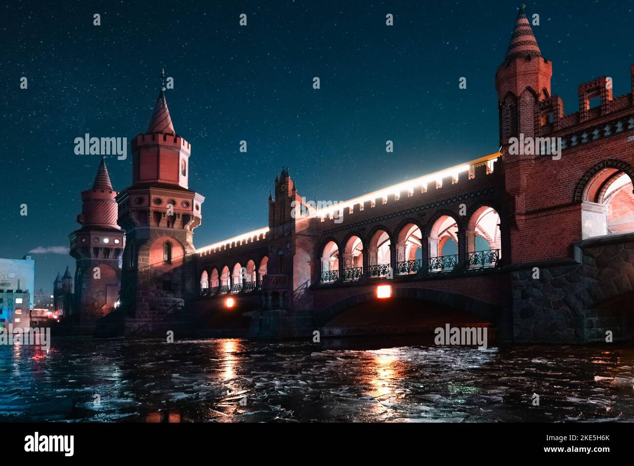 A scenic view of Oberbaum Bridge in Berlin, Germany with a starry night ...