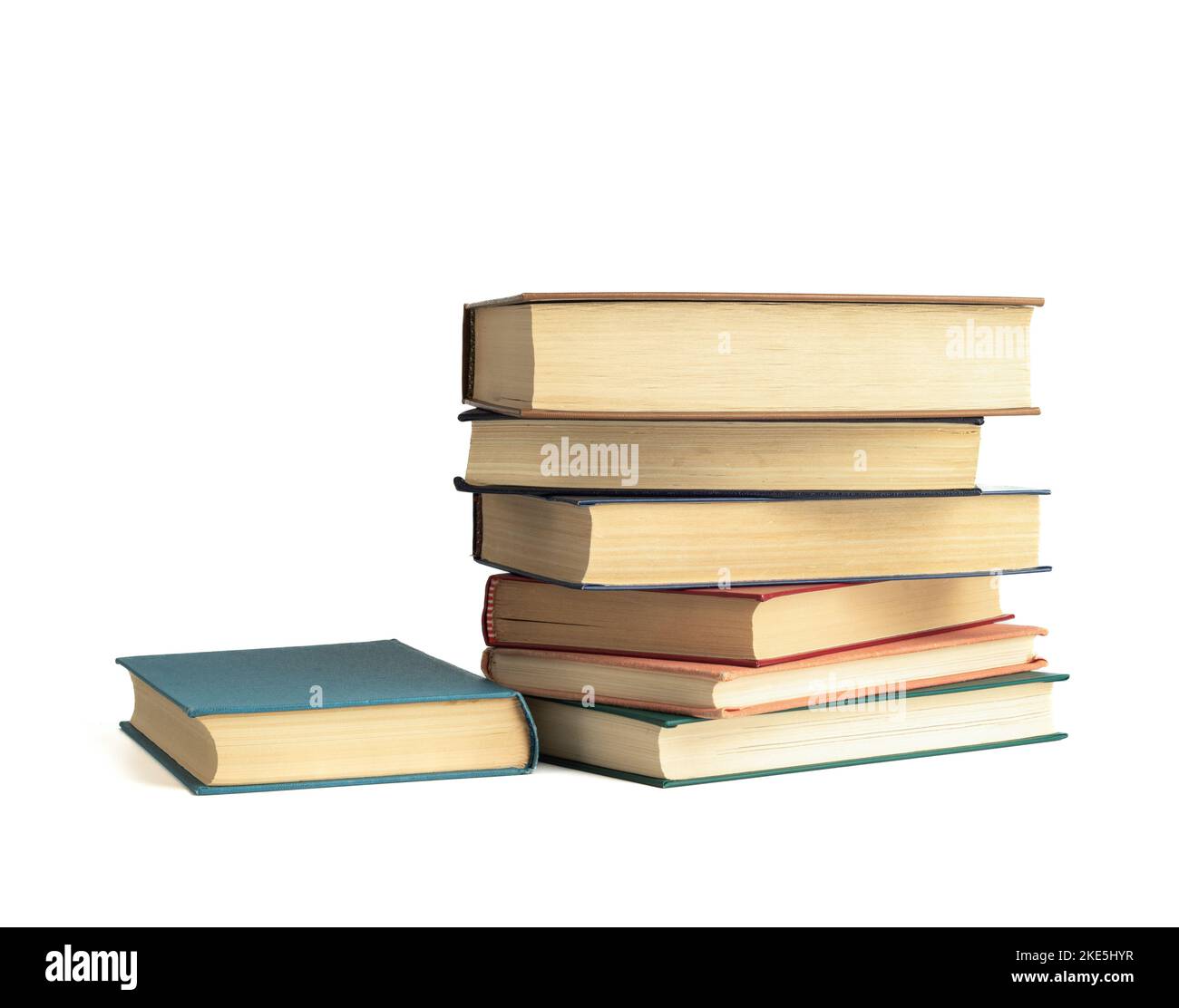 Several hardcover books isolated on a white background. Copy space. Stock Photo