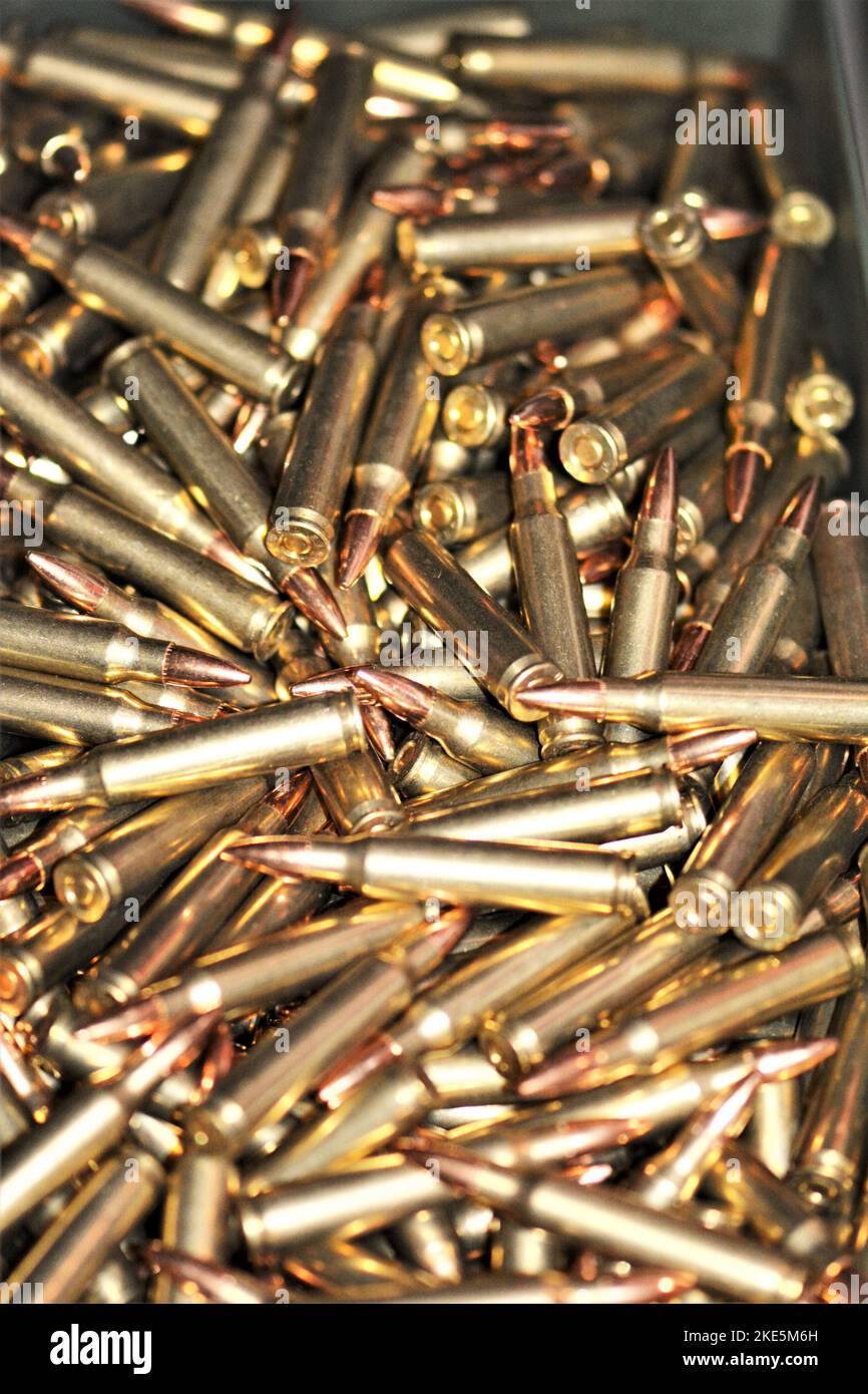 A vertical closeup of a heap golden riffle ammunition Stock Photo