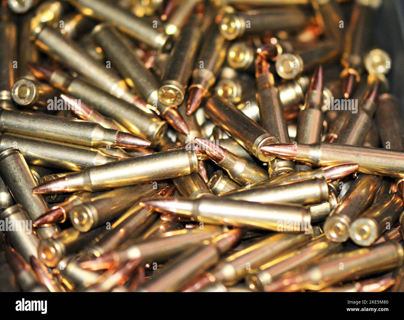 A closeup of a pile of golden rifle ammunition Stock Photo