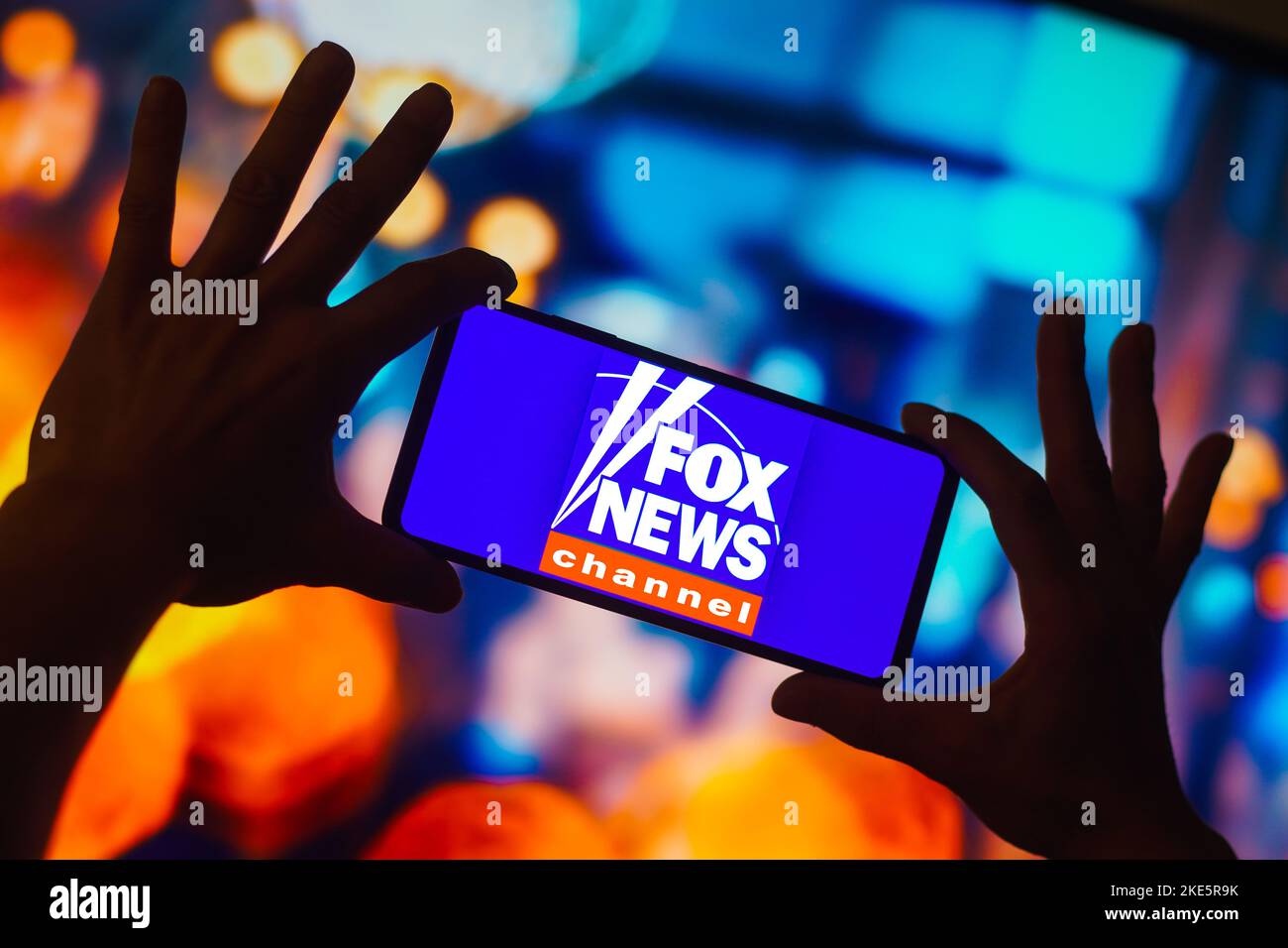 In this photo illustration, the Fox News Channel logo is displayed on a smartphone screen. Stock Photo