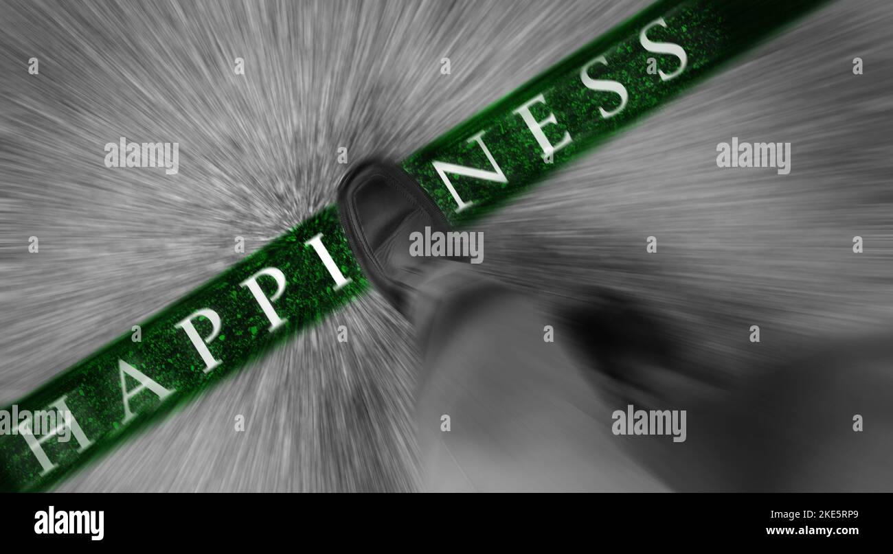 Man walking across a green line with words Happiness Stock Photo