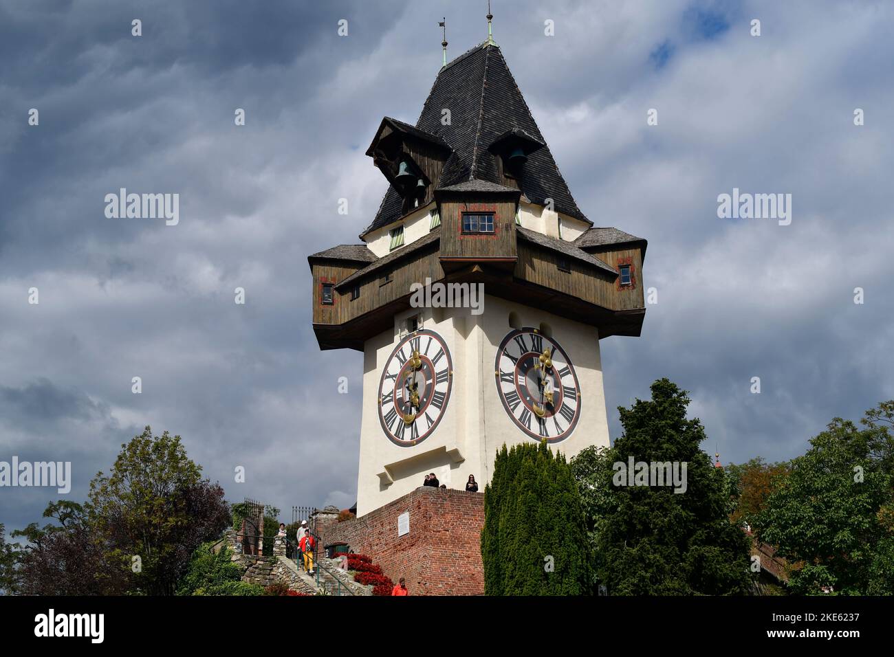 Graz, Austria - September 22, 2022: Unidentified tourists on Schlossberg hill with clock tower the landmark of Graz in UNESCO world heritage site of G Stock Photo