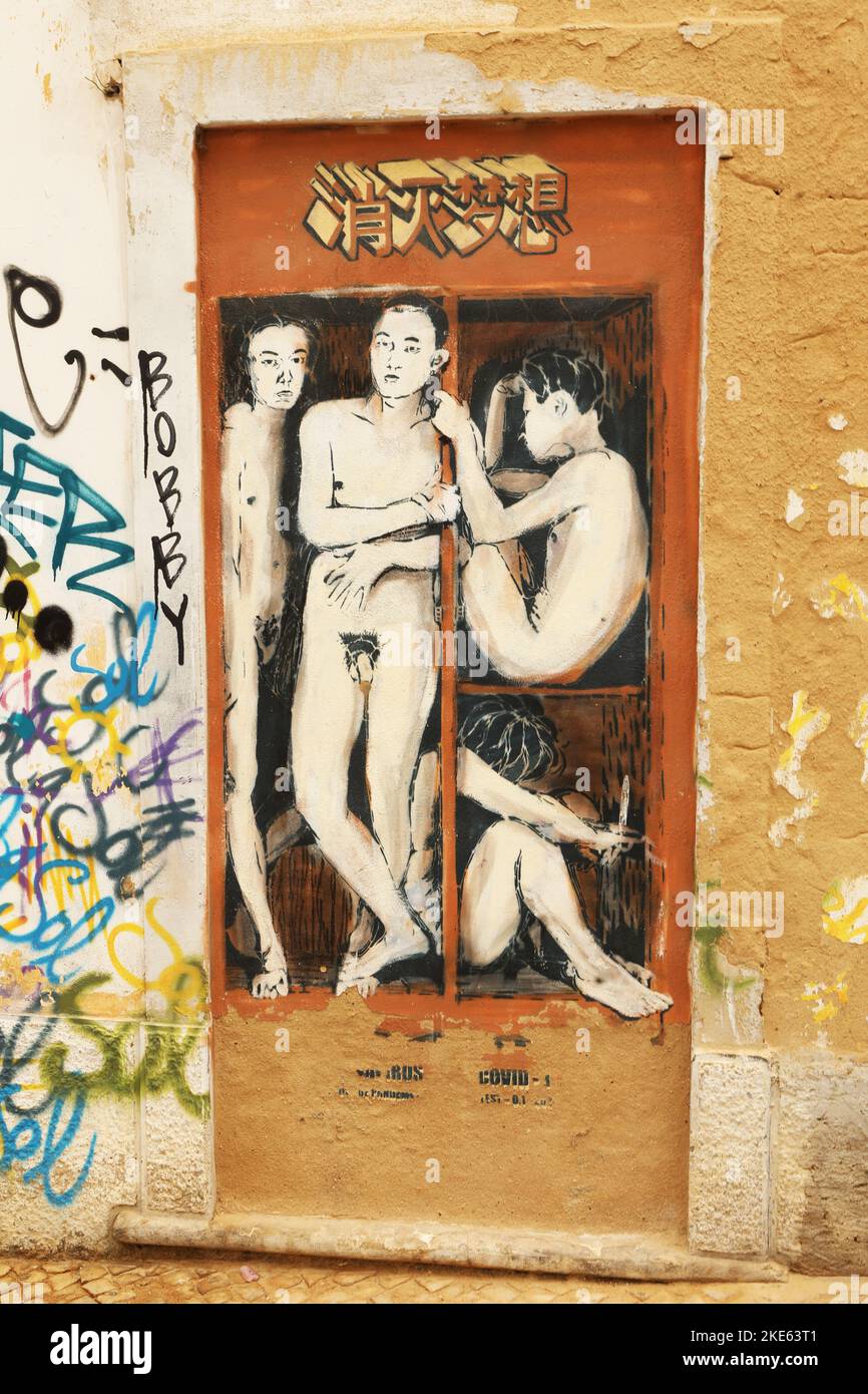 A mural of naked men standing and sitting in a small space, Lagos, Algarve, Portugal Stock Photo