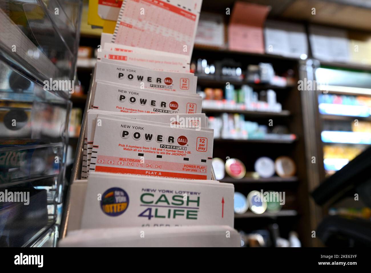 A variety of different lottery tickets stacked on the counter of a smoke shop, New York, NY