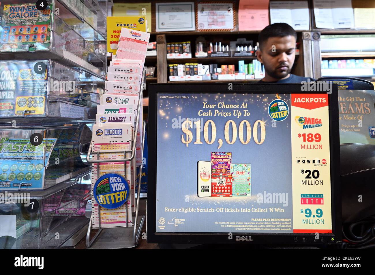 A variety of different lottery tickets stacked on the counter of a smoke shop, New York, NY