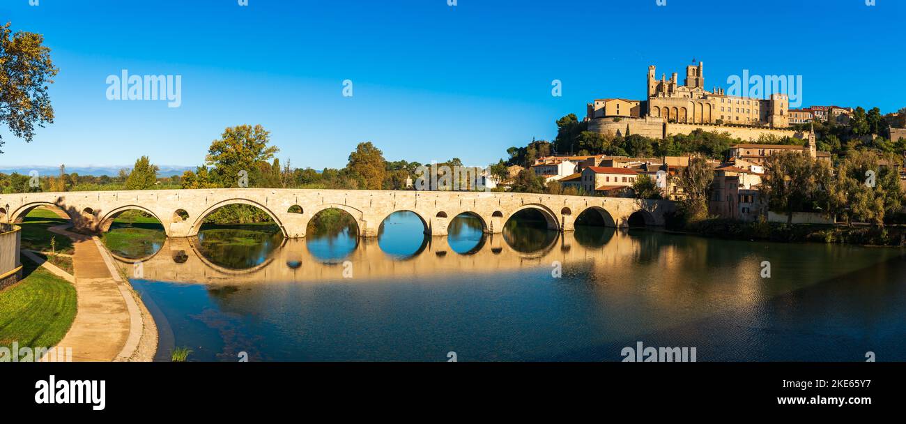 Old bridge over the Orb river and Saint Nazaire cathedral in Béziers, Hérault, Occitanie, France Stock Photo
