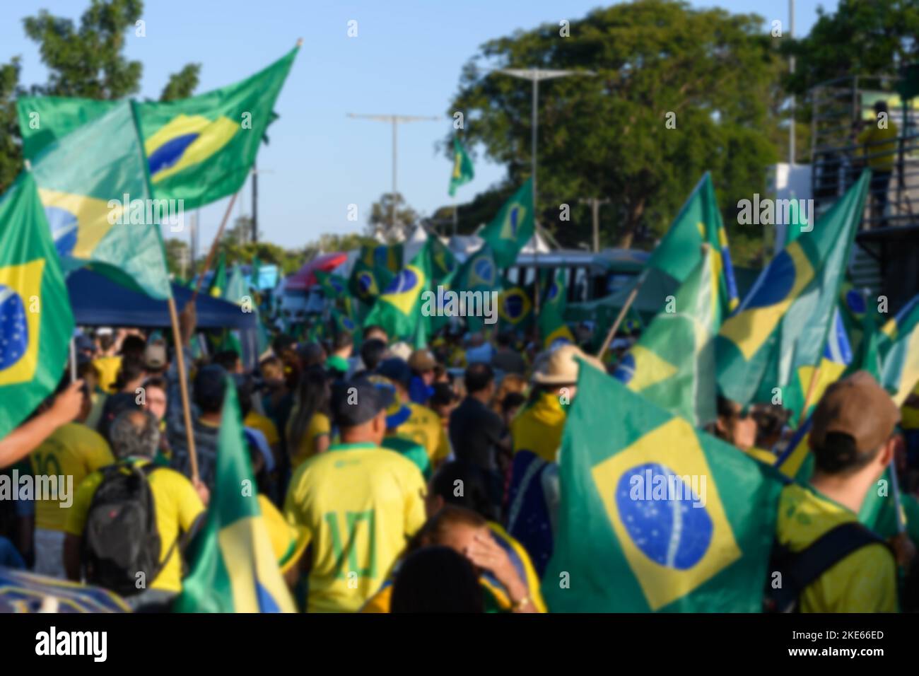 BLURRED background of brazilian people on the street, wearing green and ...