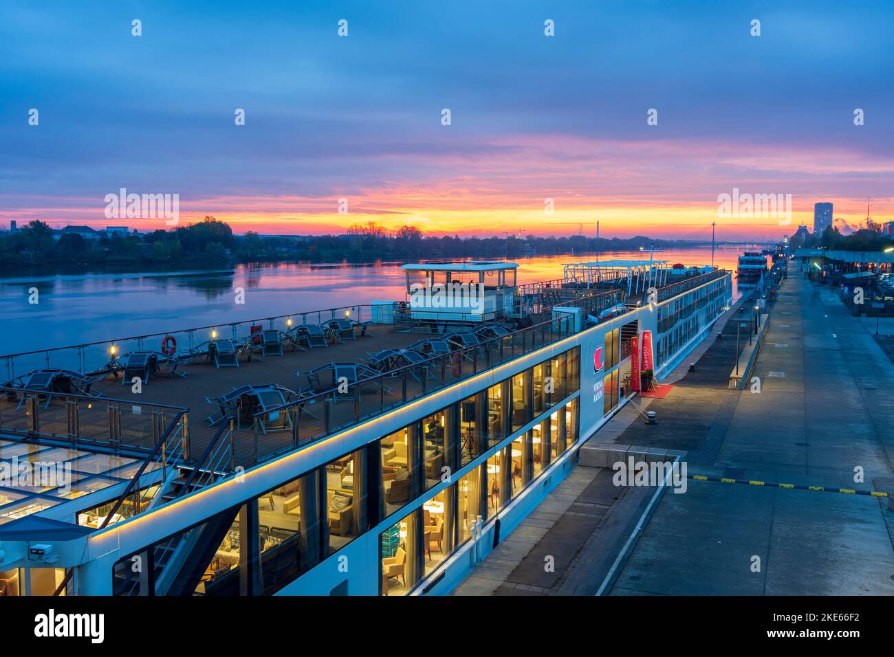 Wien, Vienna river Donau (Danube) at sunrise, cruise ship at dock at