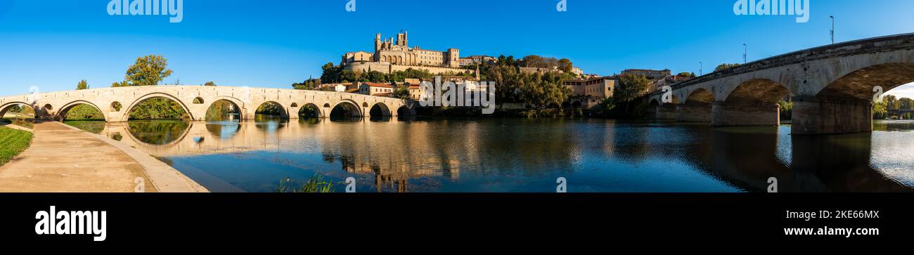 Old bridge over the Orb river and Saint Nazaire cathedral in Béziers, Hérault, Occitanie, France Stock Photo