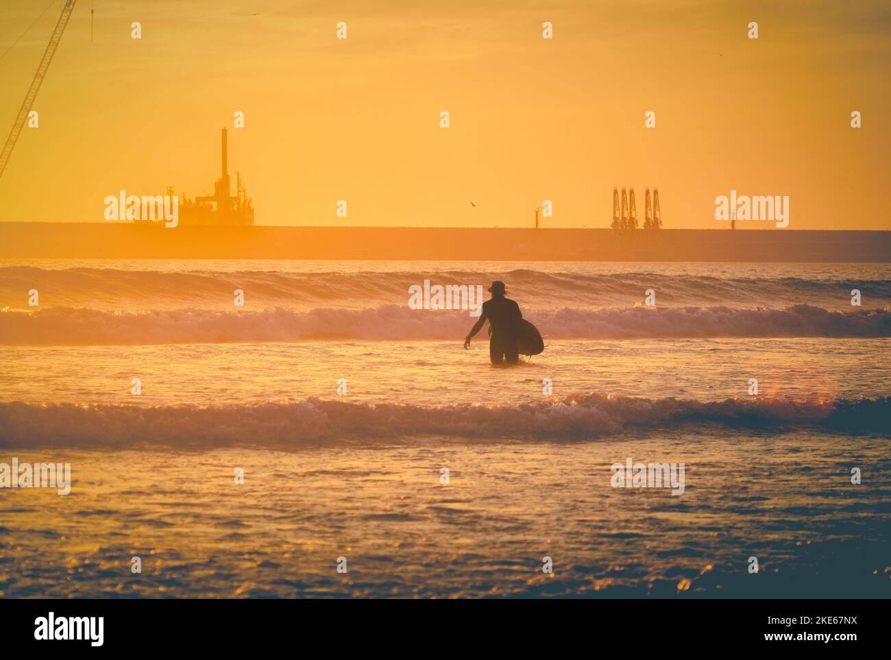 Surfer standing holding surfboard hi-res stock photography and images ...