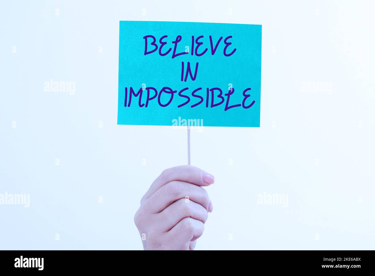 Sign displaying Believe In Impossible. Word for motivation and ...