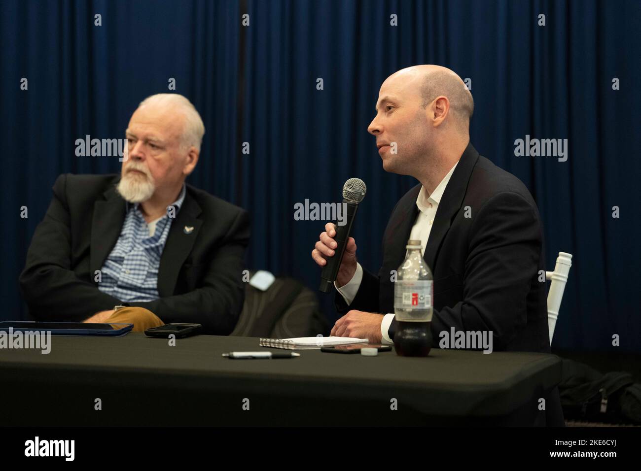 McAllen Texas USA, November 9, 2022: Long-time Republican political consultant DAVE CARNEY, left, listens as Gardner Pate, chairman of Texas Gov. Greg Abbott's re-election campaign, gives a post-election press conference talking about methods and strategy in guiding Abbott to a re-election victory the previous day. Abbott defeated Democratic challenger Beto O'Rourke to win his third term in office. ©Bob Daemmrich Stock Photo