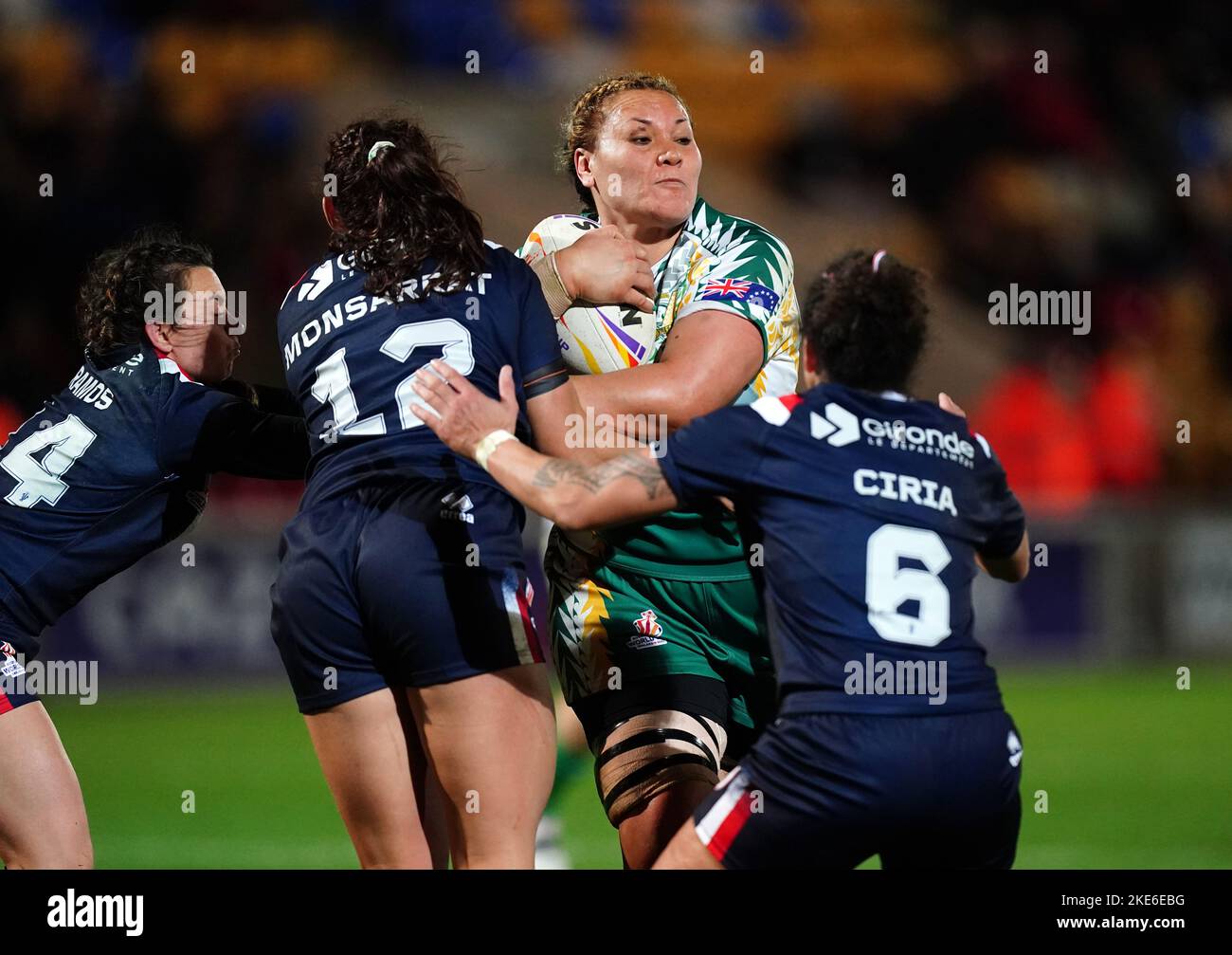 Cook Islands' Elianna Walton tackled by France's Fanny Ramos, Perinne Monsarrat and Elisa Ciria during the Women's Rugby League World Cup Group B match at the LNER Community Stadium, York. Picture date: Thursday November 10, 2022. Stock Photo