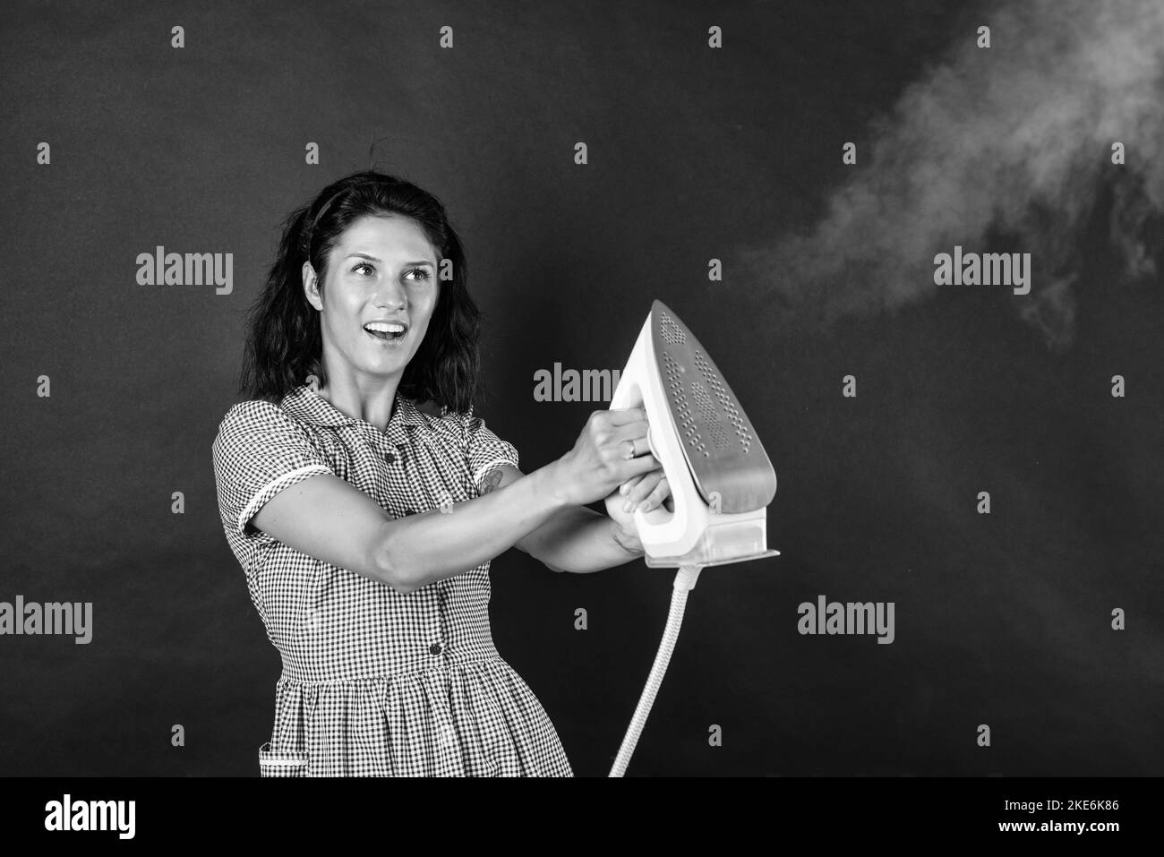 Ironing clothes Black and White Stock Photos & Images - Alamy