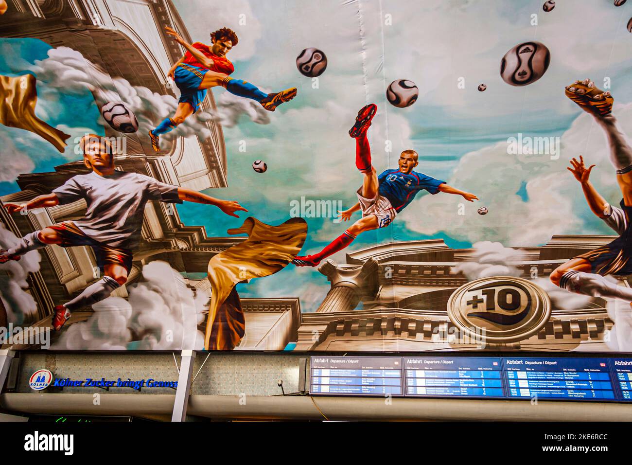 Main Train Station Ceiling Painting with Football Scenes, Köln, Germany. During 2006 FIFA World Cup. On an area of more than 800 square meters, Adidas has had a fresco installed on the ceiling of Cologne's main train station. In a true-to-the-original antique look, national players such as Michael Ballack, David Beckham, Zinédine Zidane and Juan Román Riquelme float high above the heads of passers-by Stock Photo