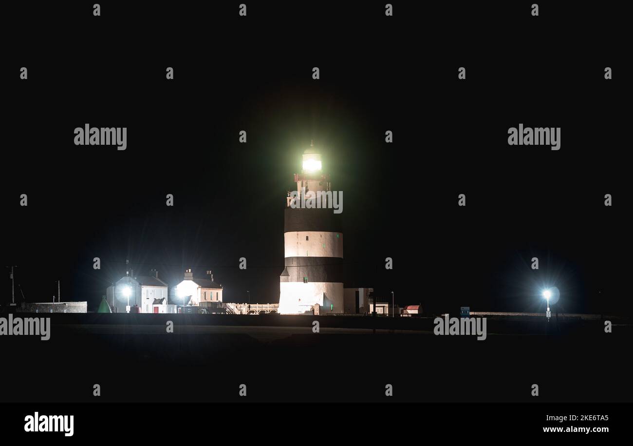 Hook Lighthouse at night. One of the oldest lighthouses in the world. Stock Photo