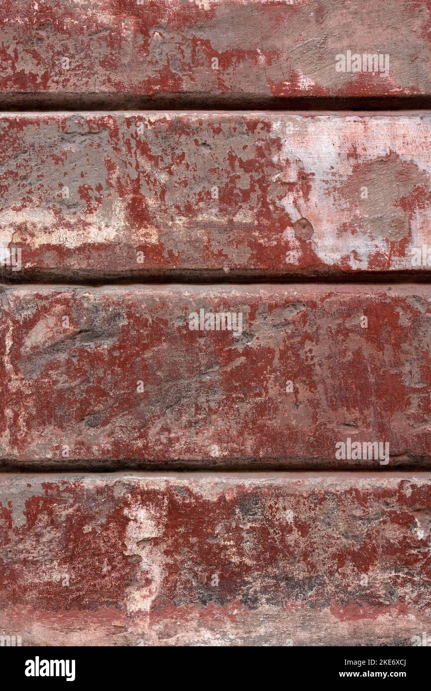 BACKGROUND TEXTURE - Old red painted wall with peeling paint Stock Photo