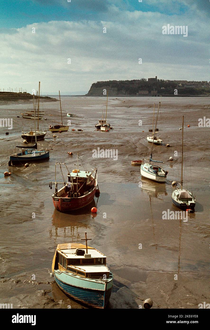 UK, Wales, Cardiff, leisure boats moored in Cardiff Bay at low tide  before barrage was built Stock Photo