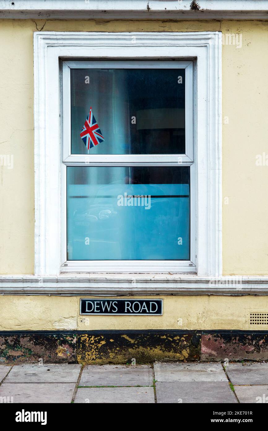 Small Union Jack British flag displayed in a house window Stock Photo