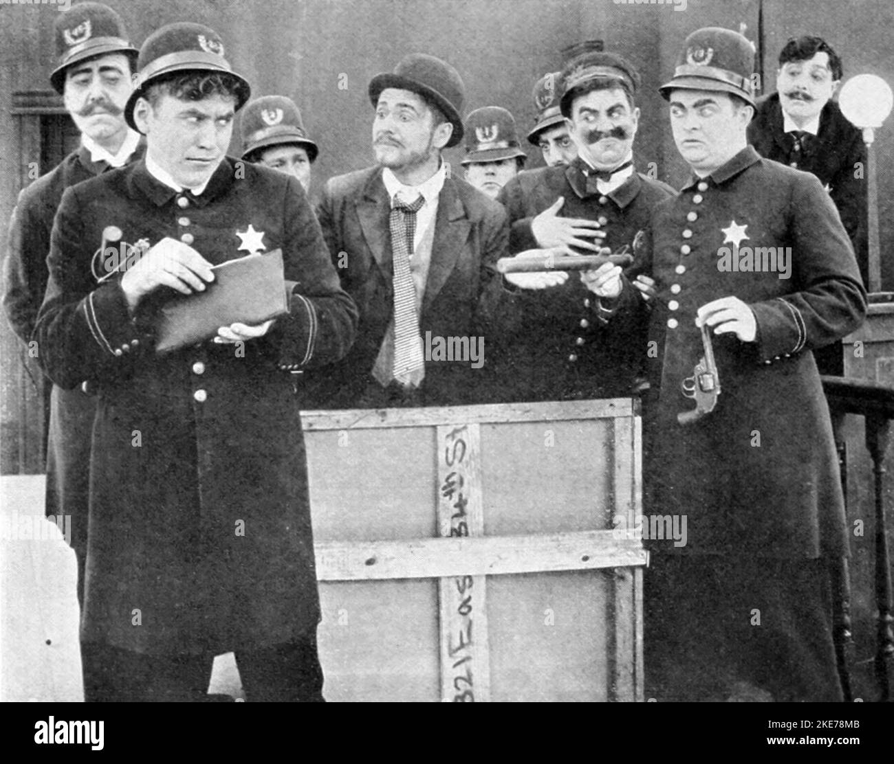 The Keystone Cops in The Stolen Purse (1913). Pictured (left to right): Robert Z. Leonard, Mack Sennett, Bill Haber, Henry Lehrman, ⸻ McAlley, Chester Franklin, Ford Sterling, Fred Mace, and Arthur Tavares. Harry Vallejo Stock Photo