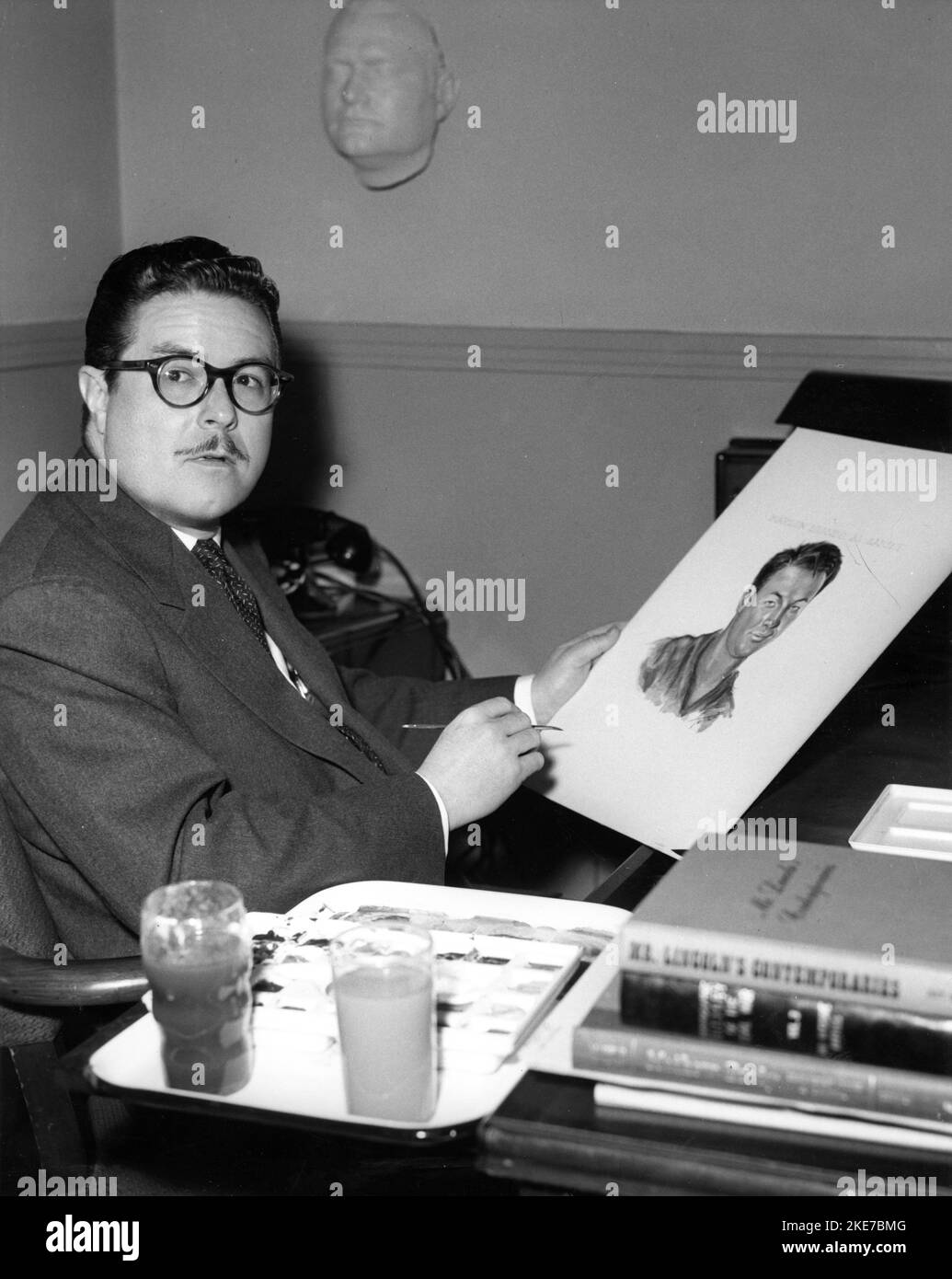 WILLIAM TUTTLE Head of MGM's Make-Up Department working on preliminary sketch for transformation of MARLON BRANDO into Okinawan interpreter Sakini in THE TEAHOUSE OF THE AUGUST MOON 1956 director DANIEL MANN book Vern J. Sneider play / screenplay John Patrick producer Jack Cummings Metro Goldwyn Mayer Stock Photo