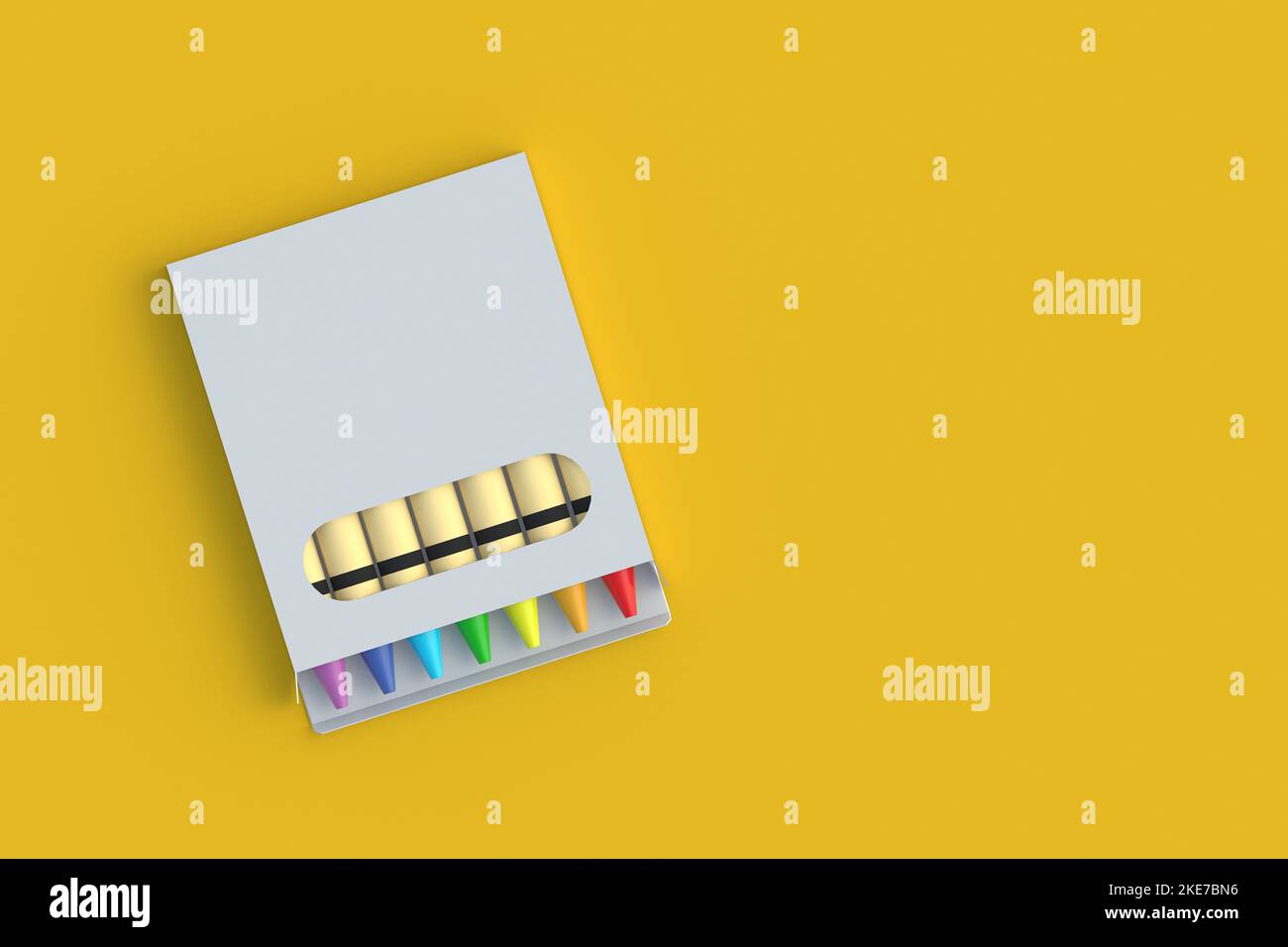 Set of wax crayons in package on yellow background. Colorful pencils ...