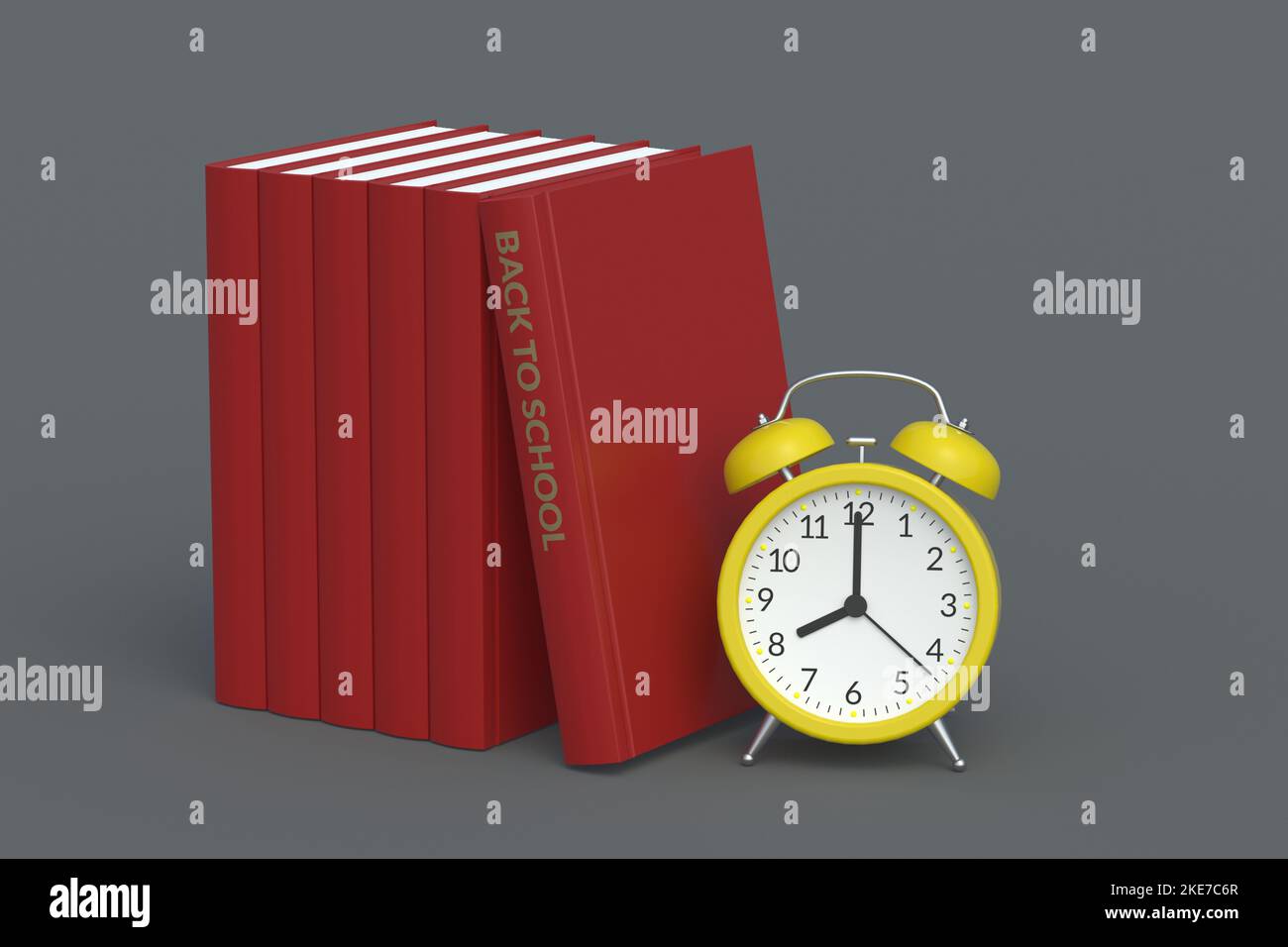 Books with inscription back to school near alarm clock. Education ...
