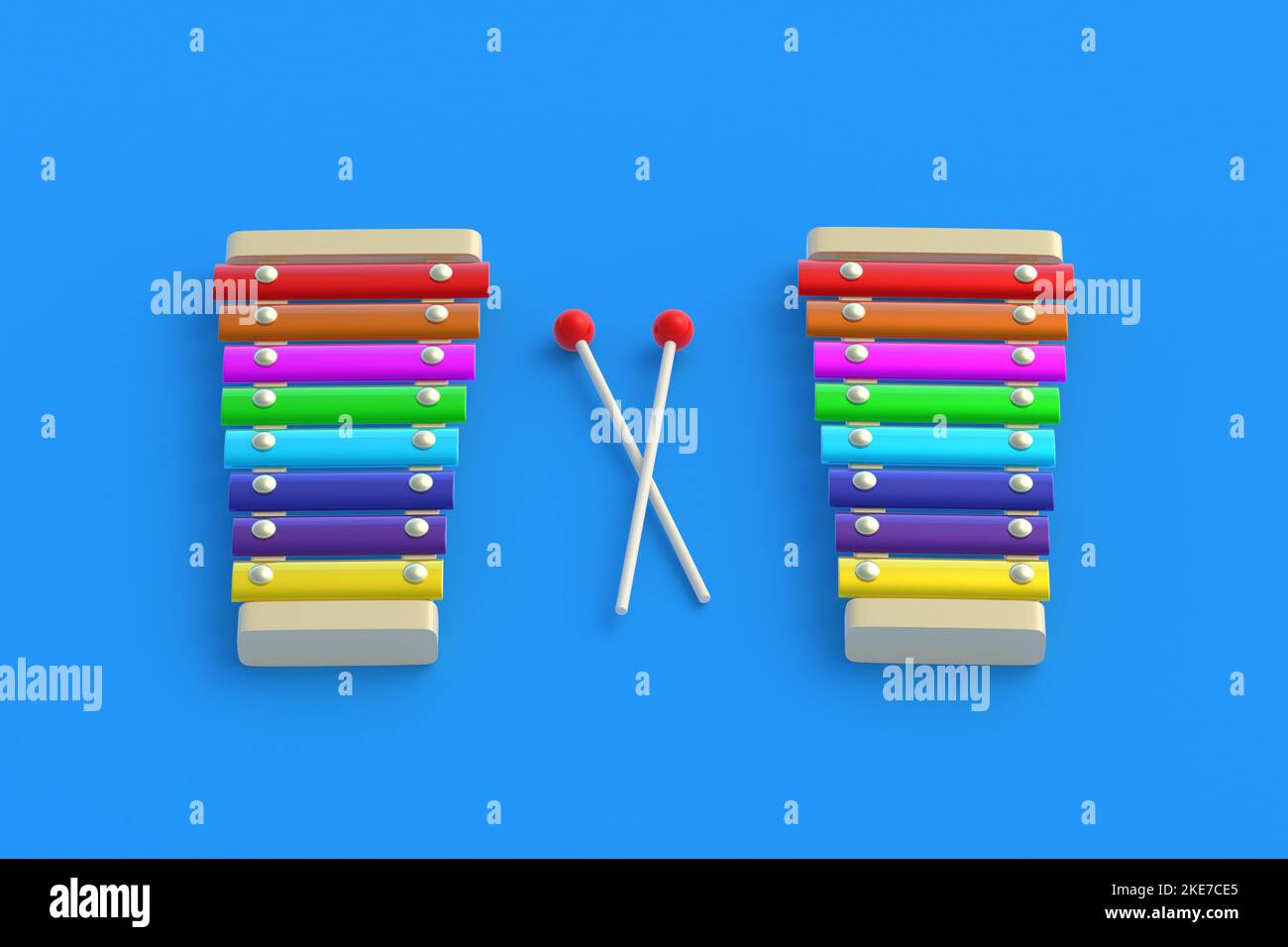 Colorful xylophones and sticks on blue background. Kids toy. Preschool