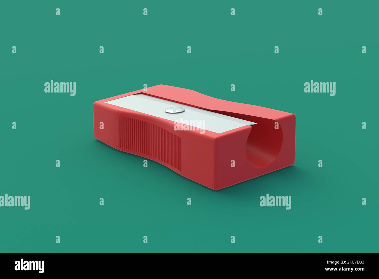 Pencil sharpener on green background. Stationery accessories. Tool for