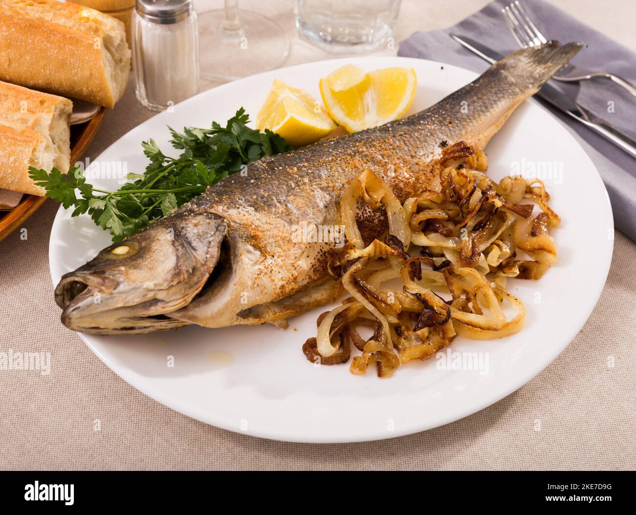 Oven baked sea bass fish Stock Photo Alamy