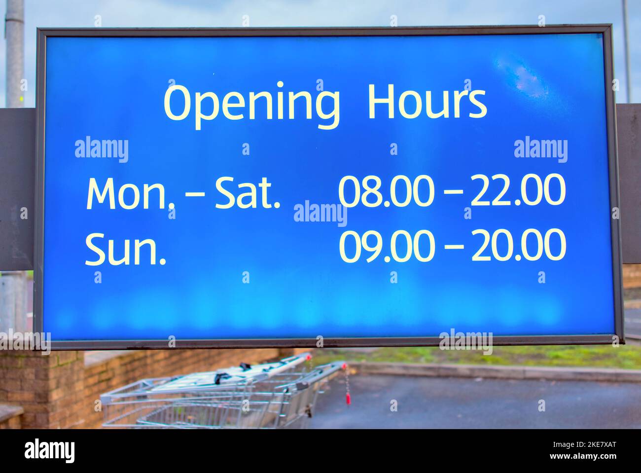 Shop business opening hours sign Stock Photo Alamy
