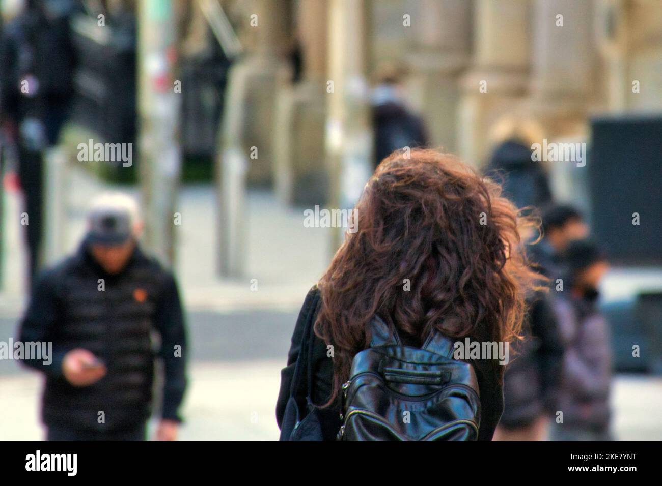 candid people walking on the street female woman girl Stock Photo