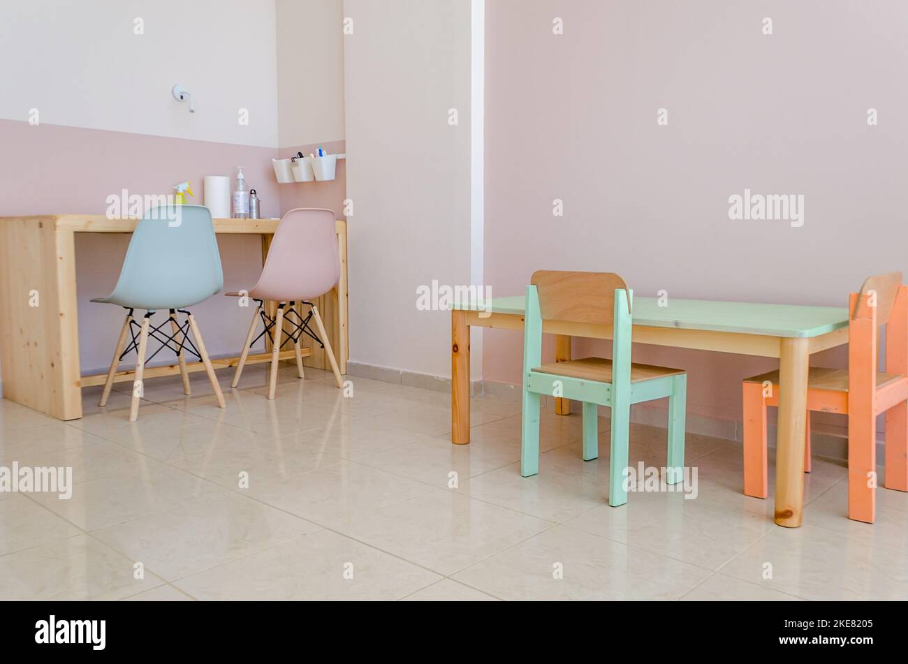 Modern Occupational Therapy Classroom. Nice Colored Wooden Furniture Sets with Tables and Chairs. Interior Design and Stylish Decoration. Stock Photo