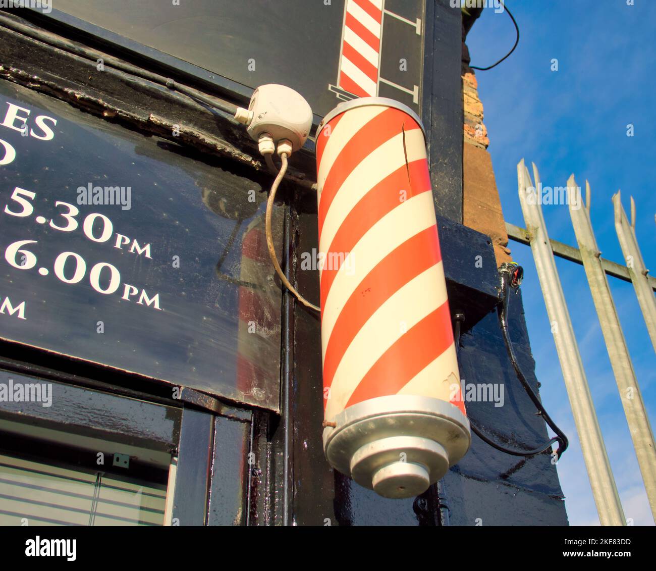 vintage barber red and white pole shop sign Stock Photo