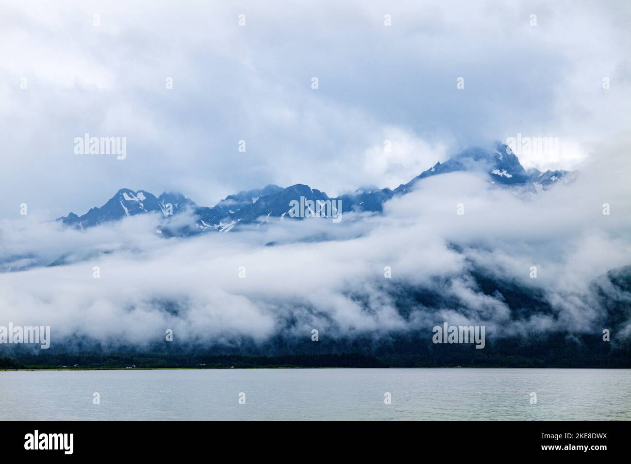 Low lying clouds; Resurrection Bay; Chugach National Forest beyond; Seward; Alaska; USA Stock Photo
