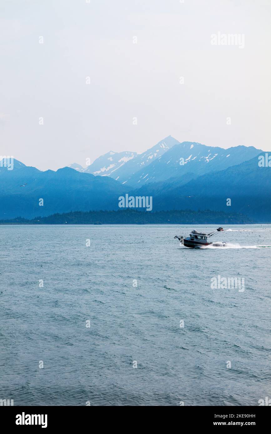 Fishing boat; foggy; misty; view of Kachemak Bay; Kenai Mountains; Homer; Alaska; USA Stock Photo