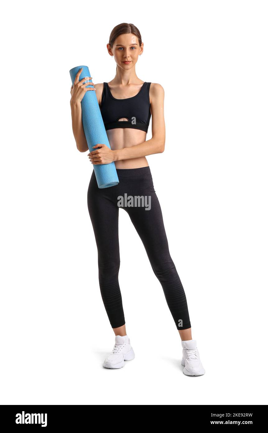 Sporty young woman with yoga mat on white background Stock Photo - Alamy