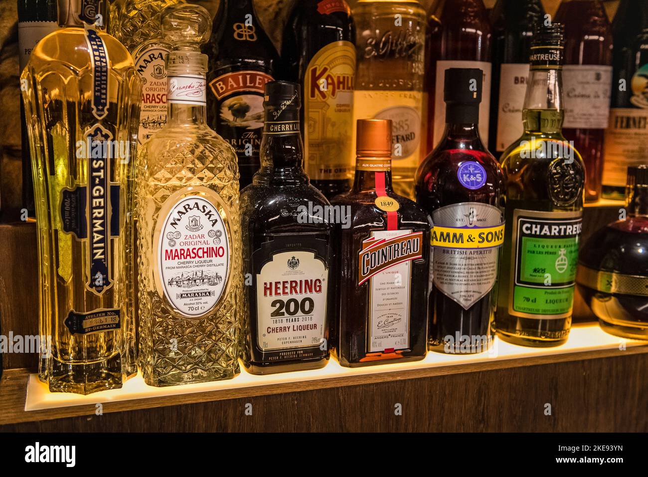 Collection of bottles on shelves Stock Photo Alamy