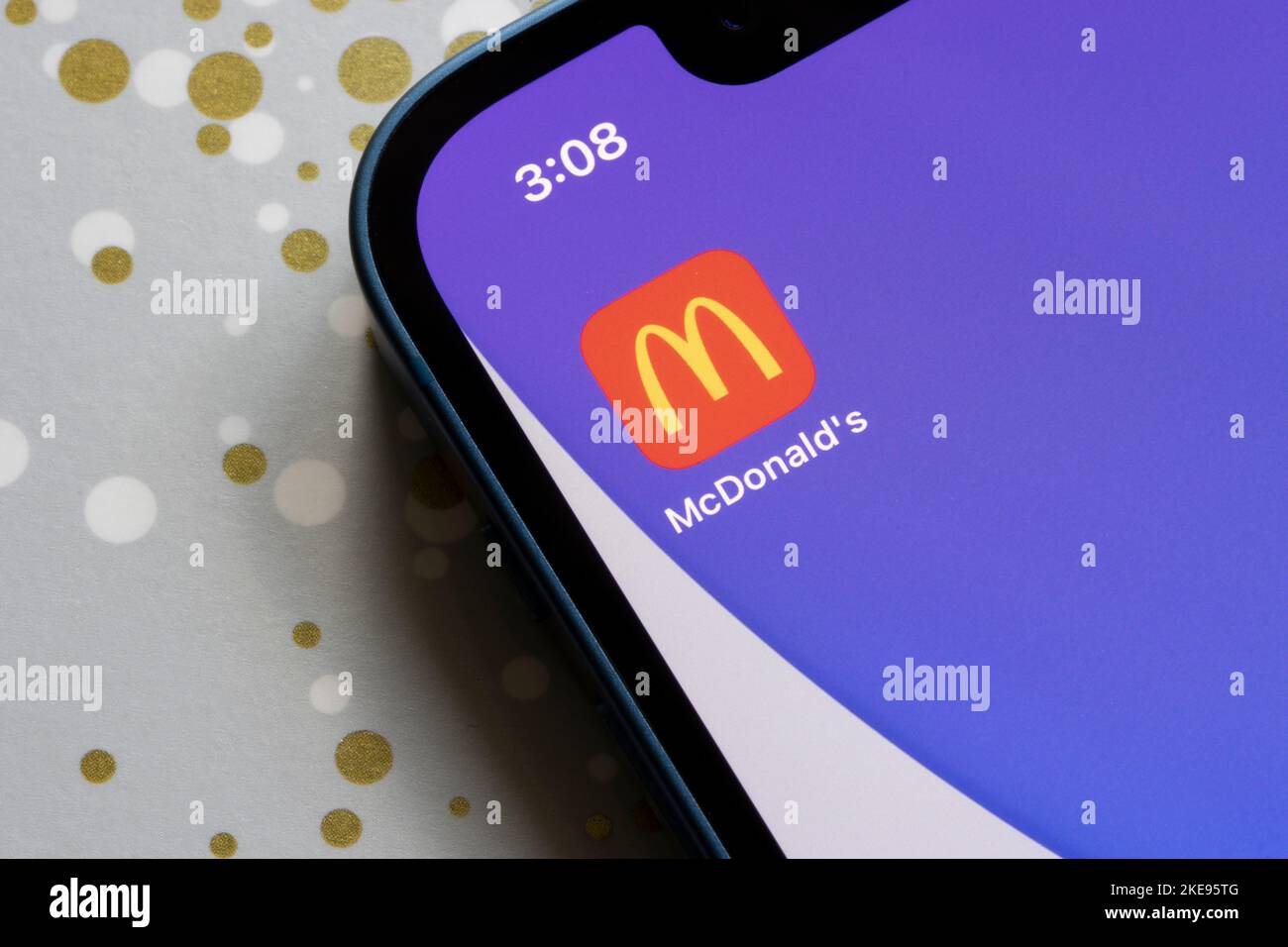 McDonald's app icon is seen on an iPhone. McDonald's Corporation is an American fast food chain and real estate company headquartered in Chicago. Stock Photo